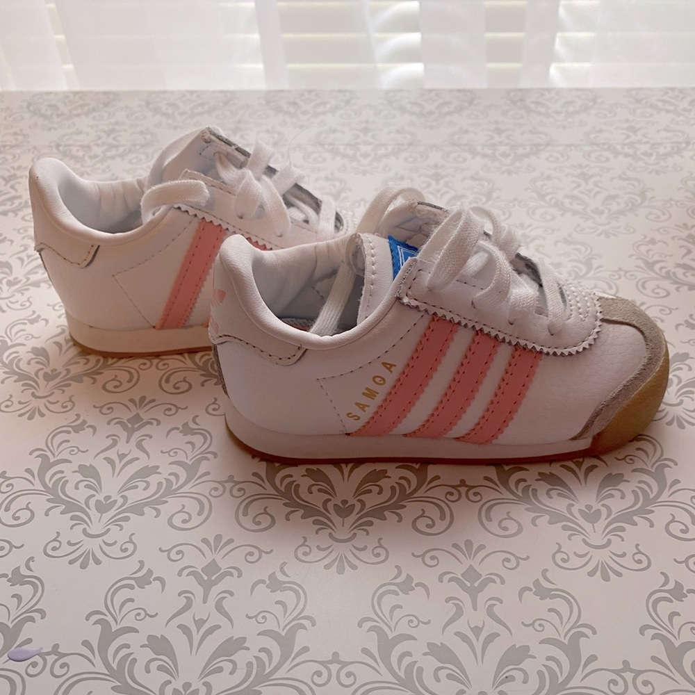 White and pink adidas